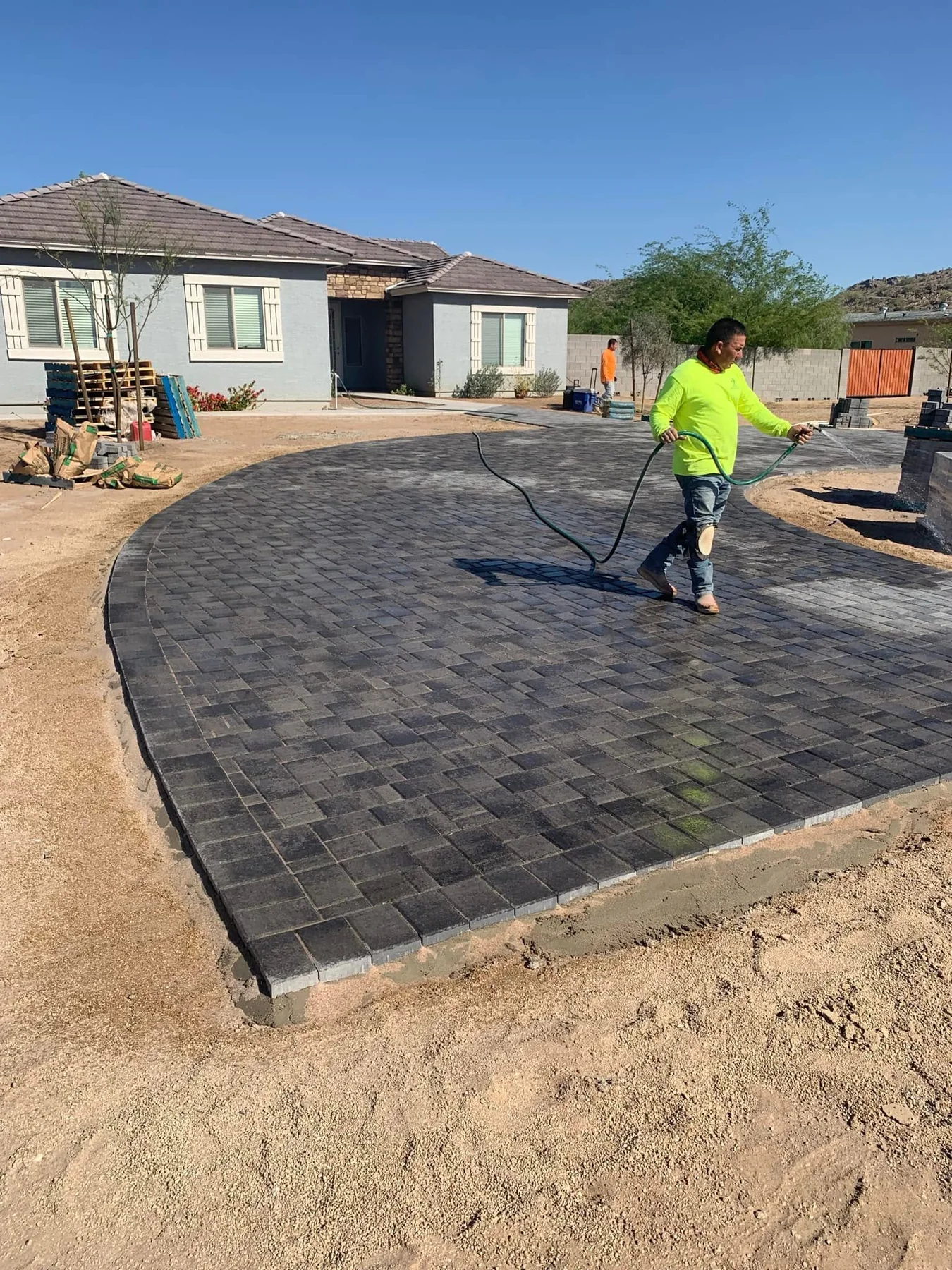 Curved paver driveway installation in progress